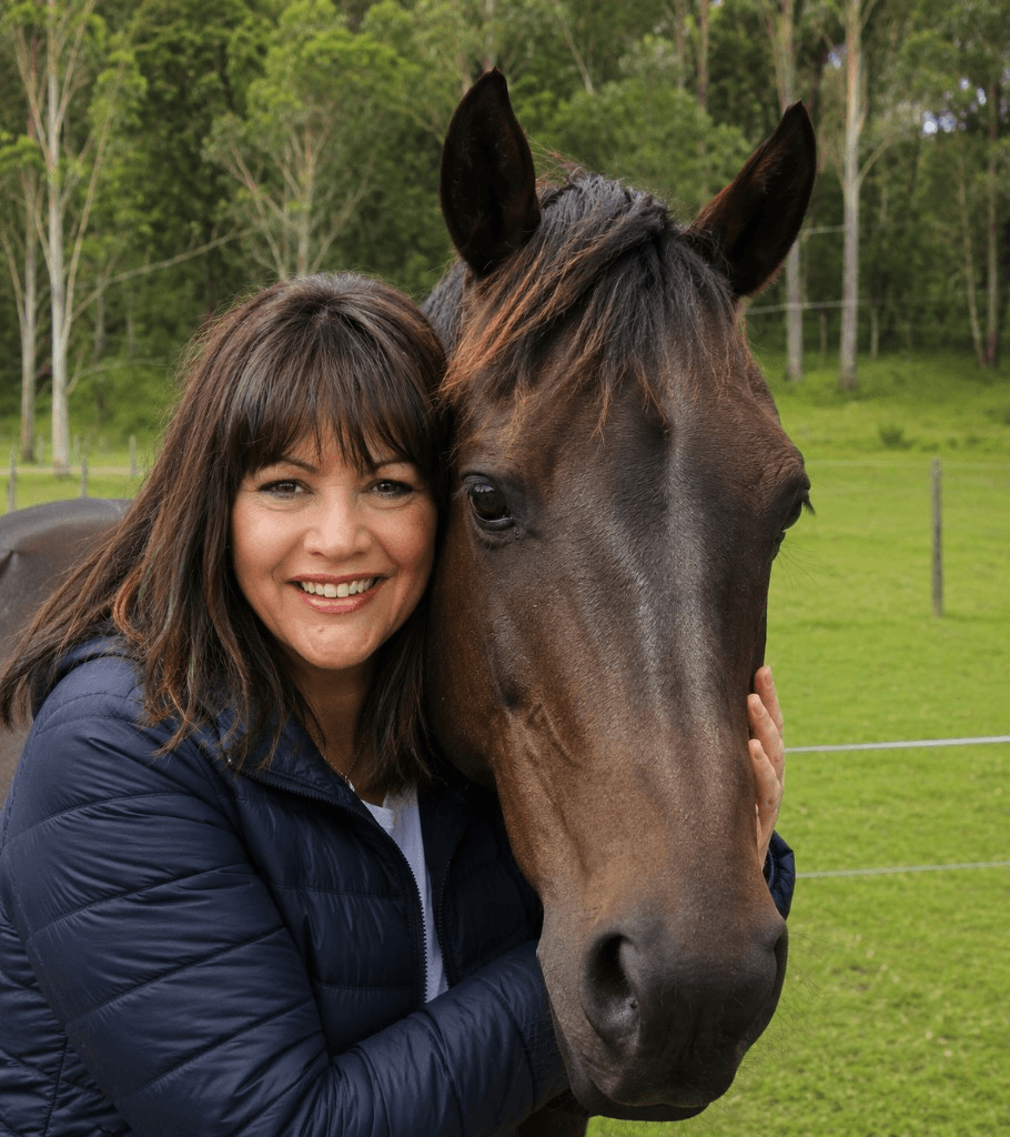 STRIDE founder smiling alongside a horse at the Lower Hunter Valley property